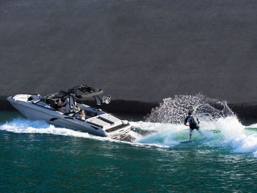 Surfing off a Centurion Fi 23 boat rental at Lake Powell Utah , AZ