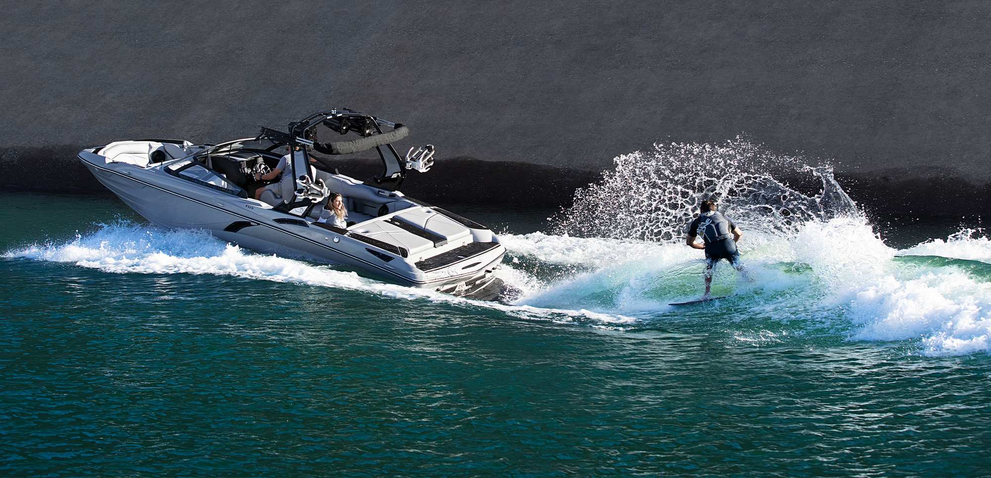 On the water wakesurfing boat for rent a Centurion Fi23